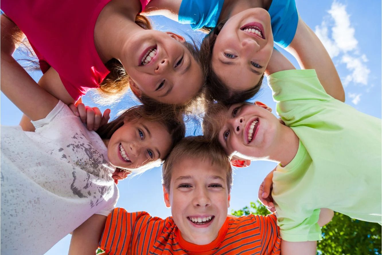 Children smiling together outdoors